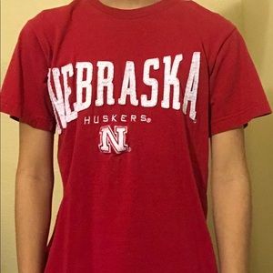 Red and white Nebraska Huskers tee.
